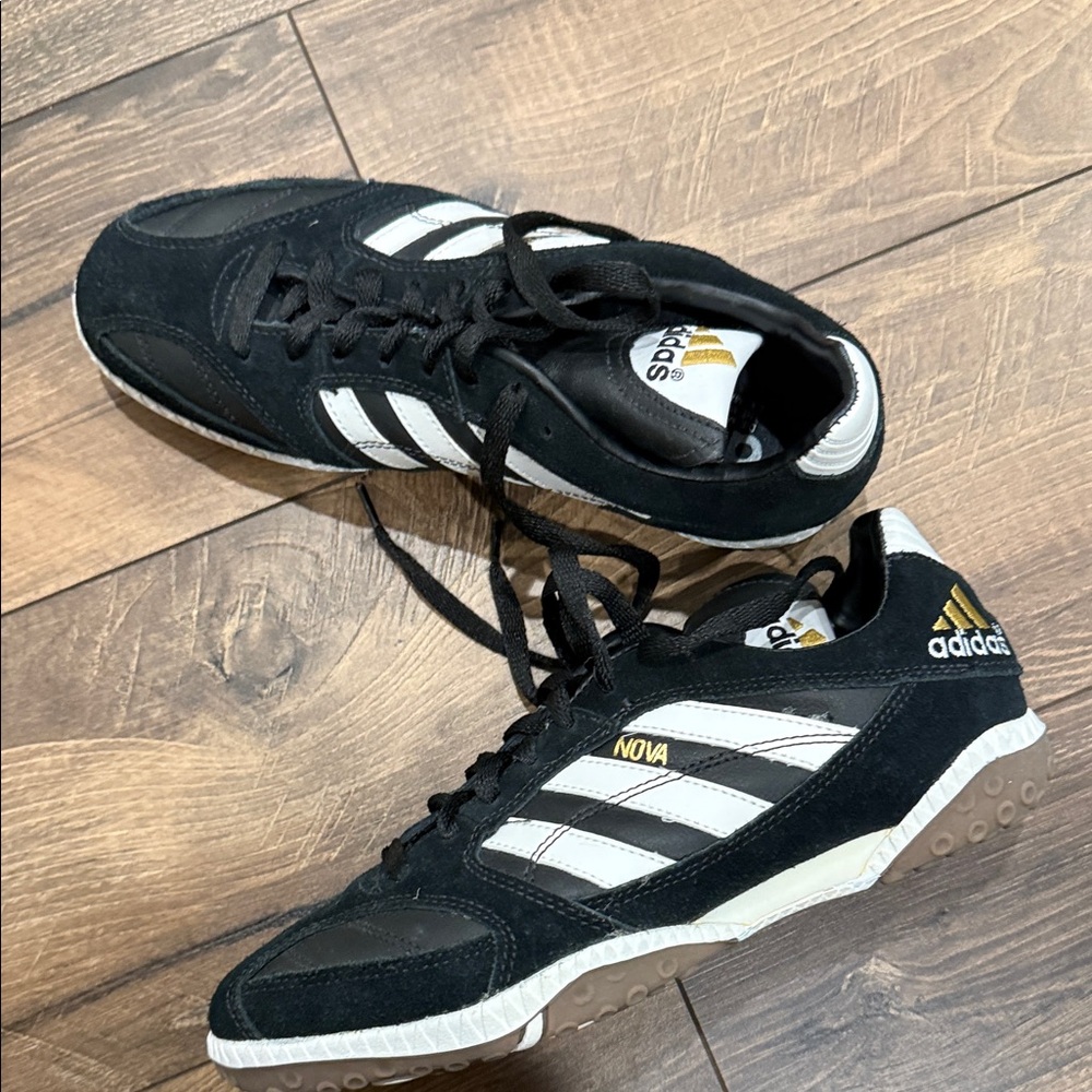 Adidas Black and White Athletic Shoes with Gold Accents
